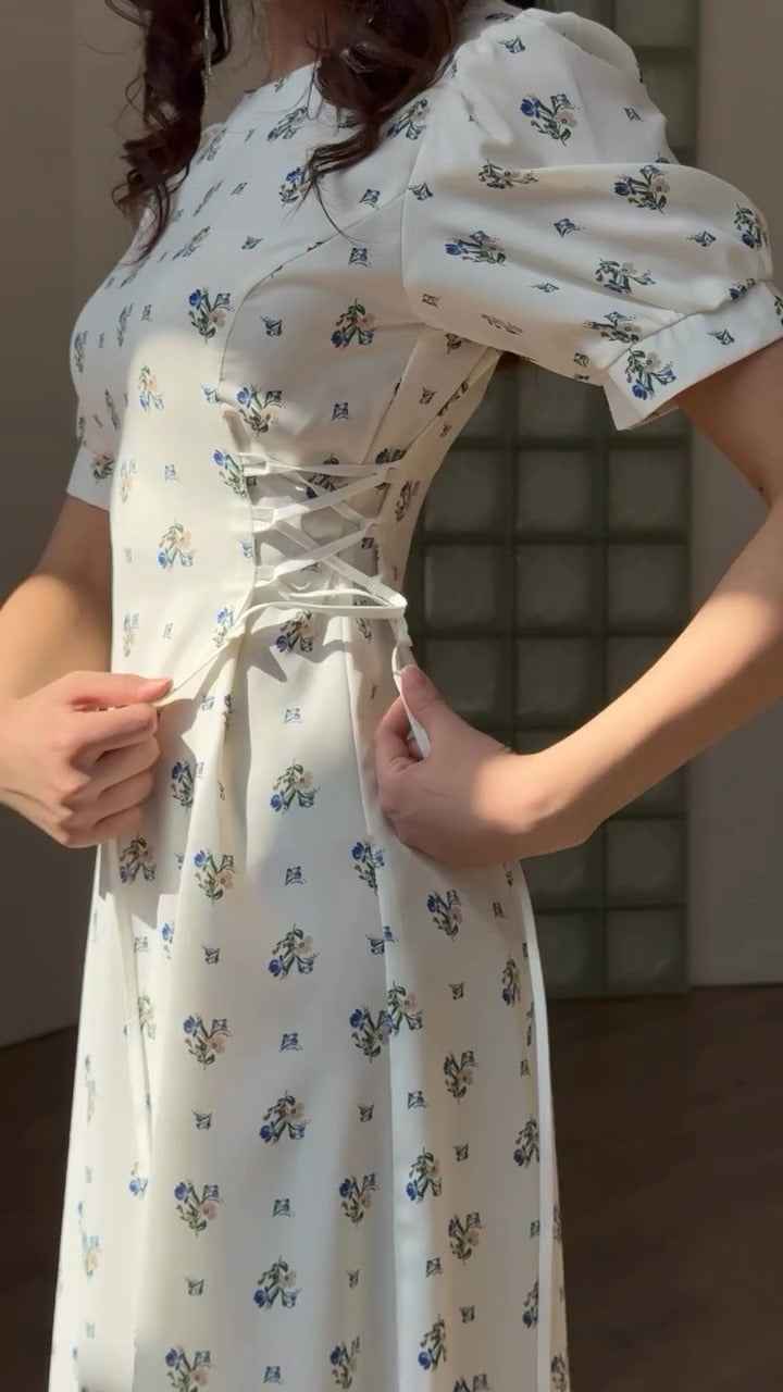 white midi dress with a blue floral print