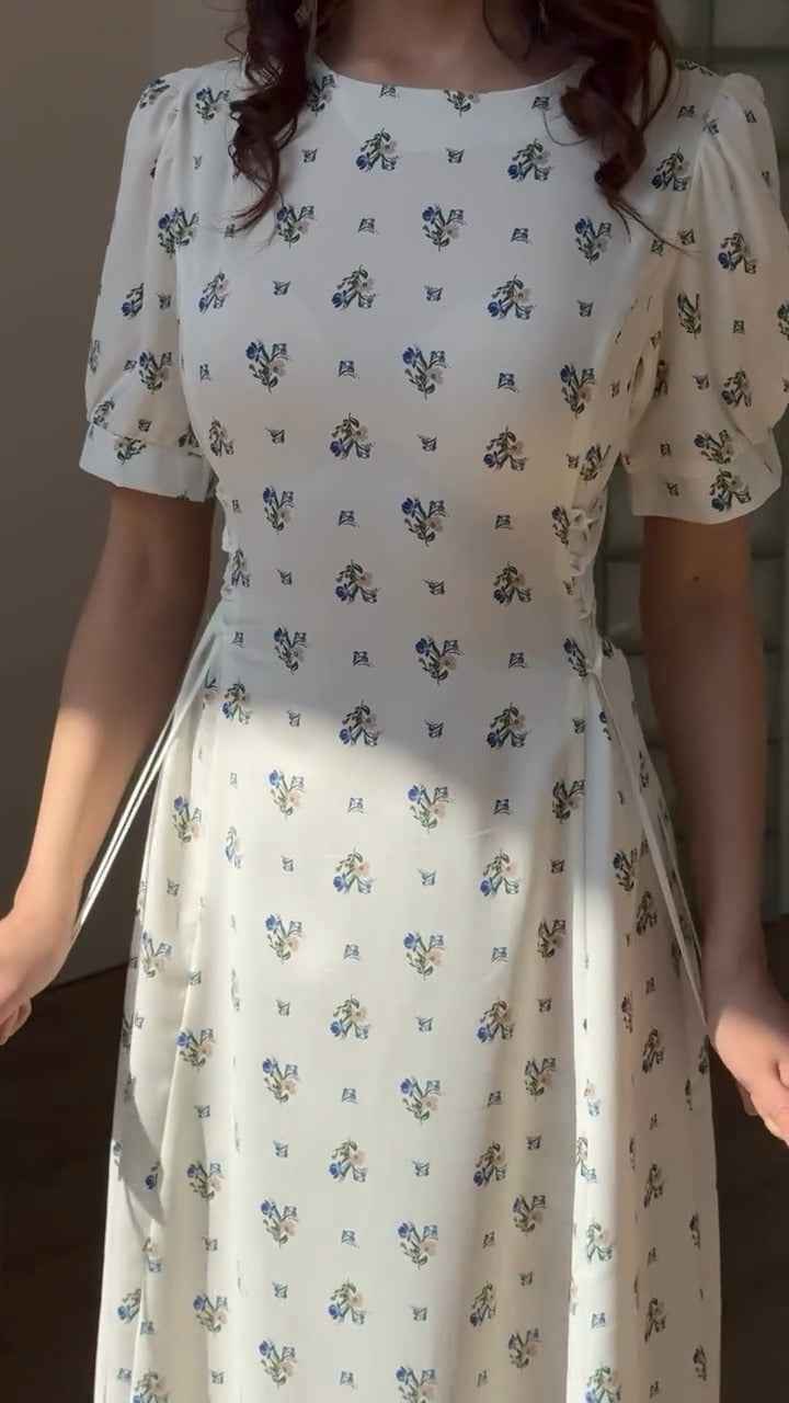 white midi dress with a blue floral print