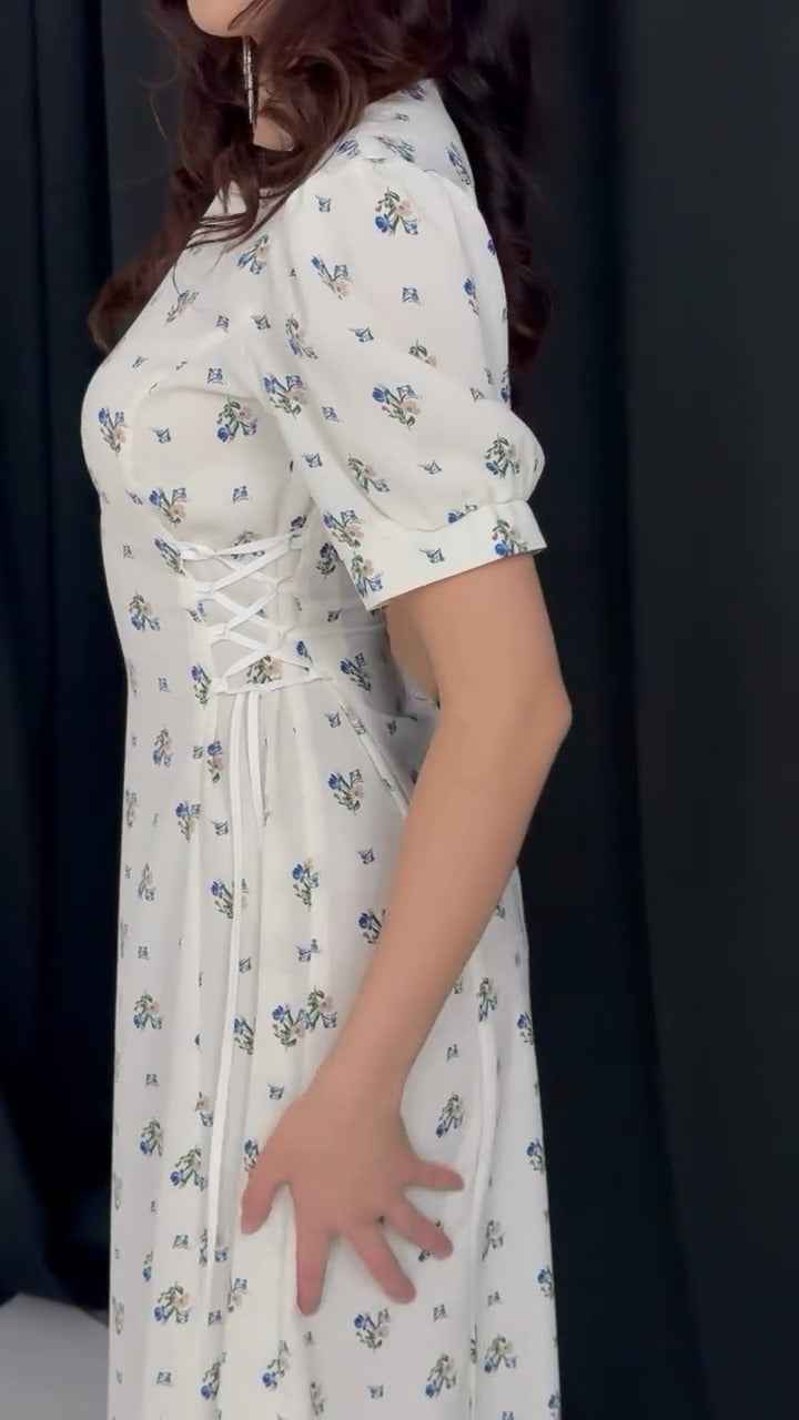 white midi dress with a blue floral print