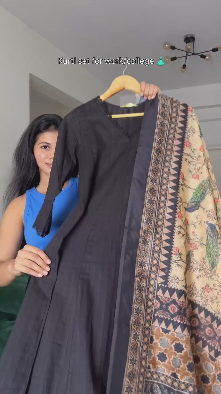 black kurta set with a multi-colored patterned dupatta