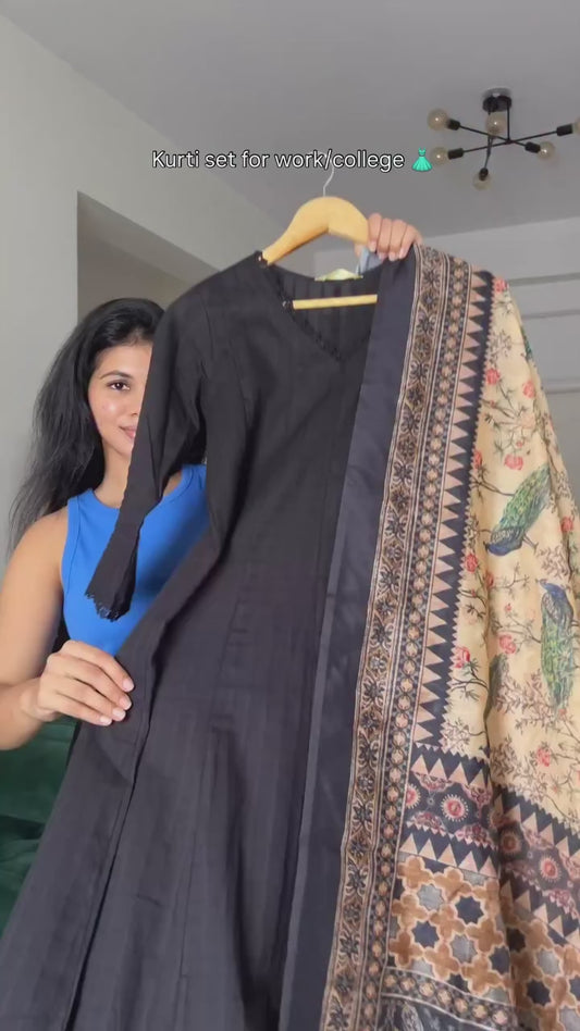 black kurta set with a multi-colored patterned dupatta